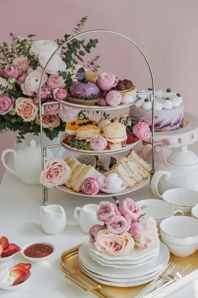 round-three-tiered-stand-with-a-pot-and-cups-on-a-table